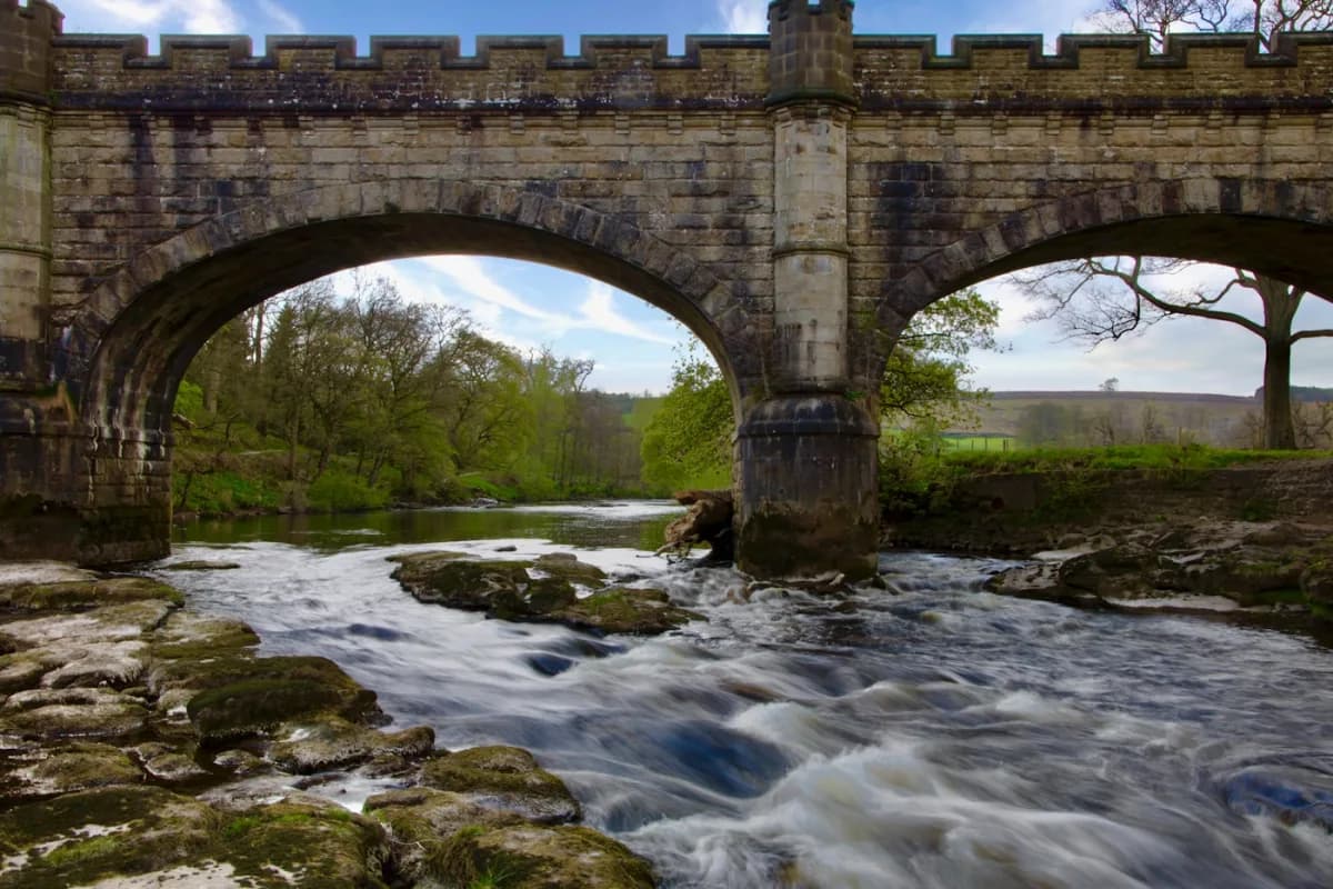 Stone bridge over the River Wharfe at Bolton Abbey — green Dales valley, Yorkshire