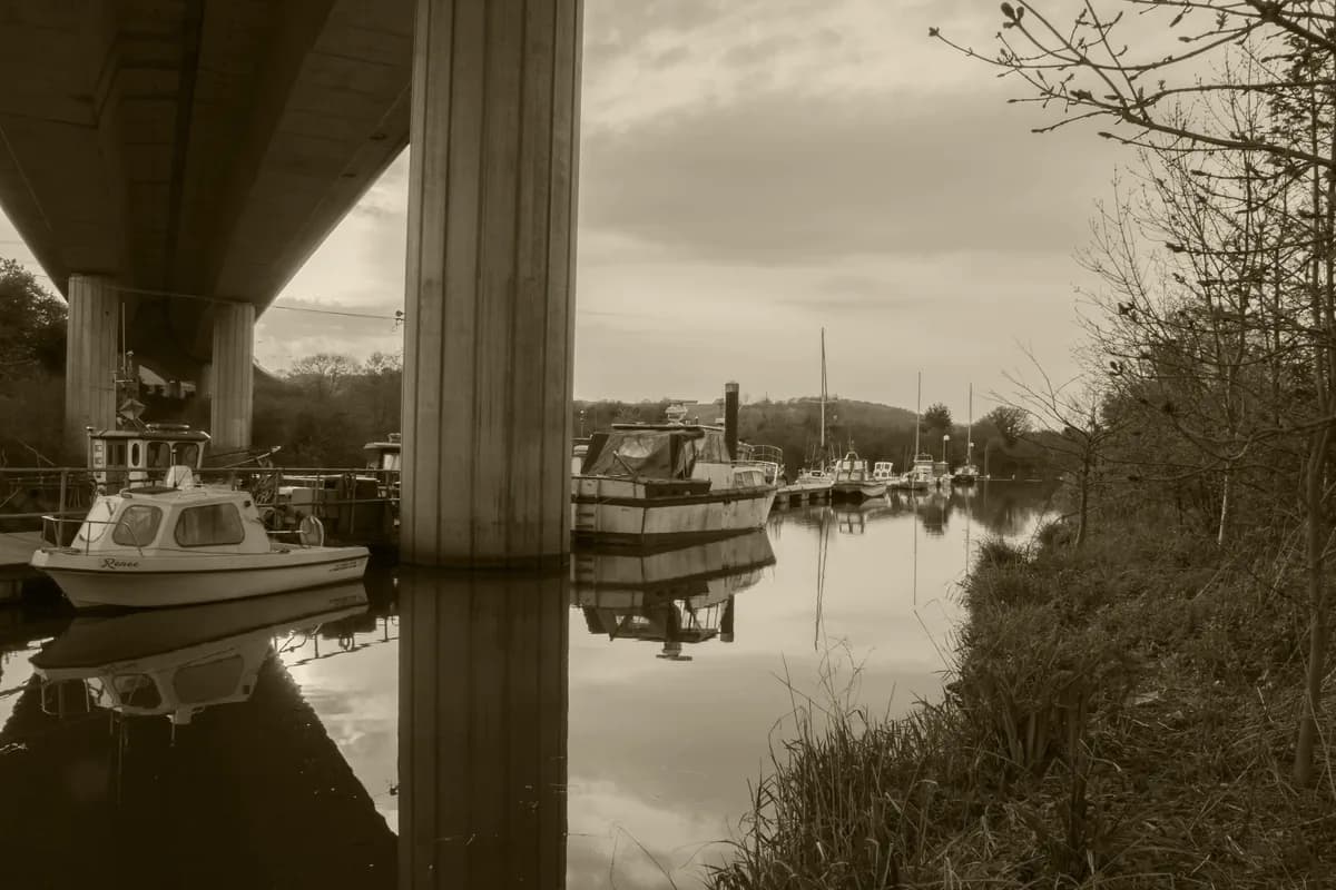 The River Ely flowing through green banks near Cardiff, Wales