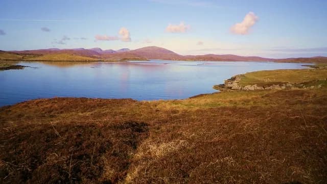 View of Loch Roag near Hacklete on Great Bernera in the Outer Hebrides, with calm sea-loch water and distant hills.