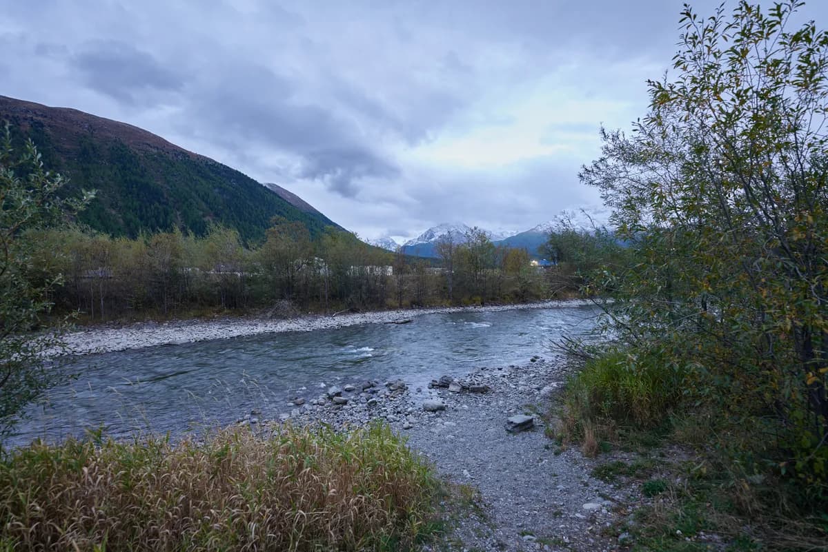 Gravel-bar reach of the Inn river with Alpine peaks in the background, Engadin