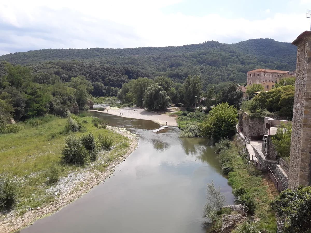 The Fluvia river flowing past the historic town of Besalu, Catalonia
