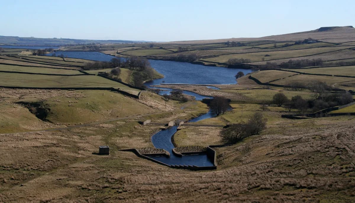 Aerial view of Blackton Reservoir in the Pennine hills of County Durham, with the River Balder feeding in through a stone-walled channel