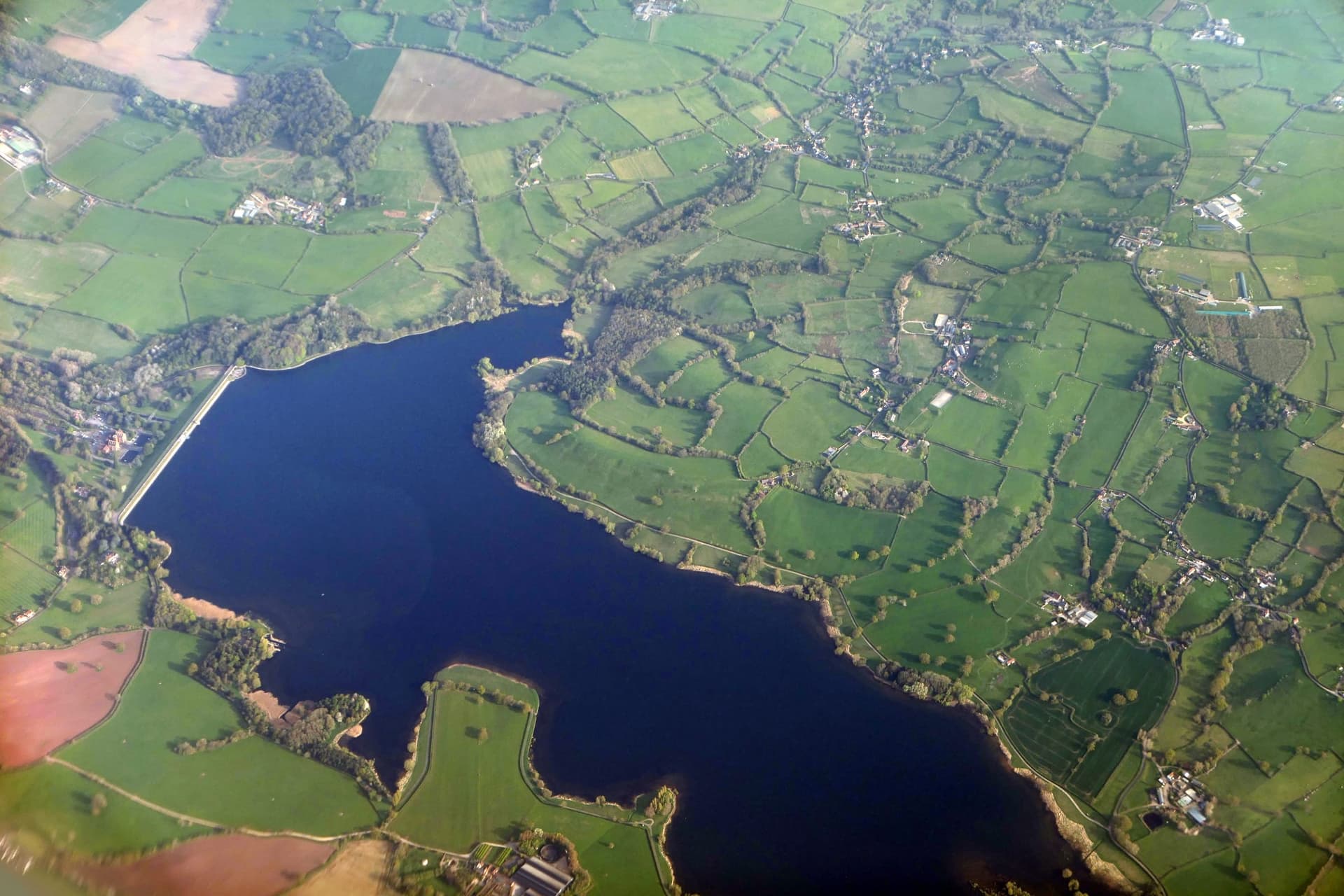 Aerial photograph of the western half of Blagdon Lake including the dam, Somerset.