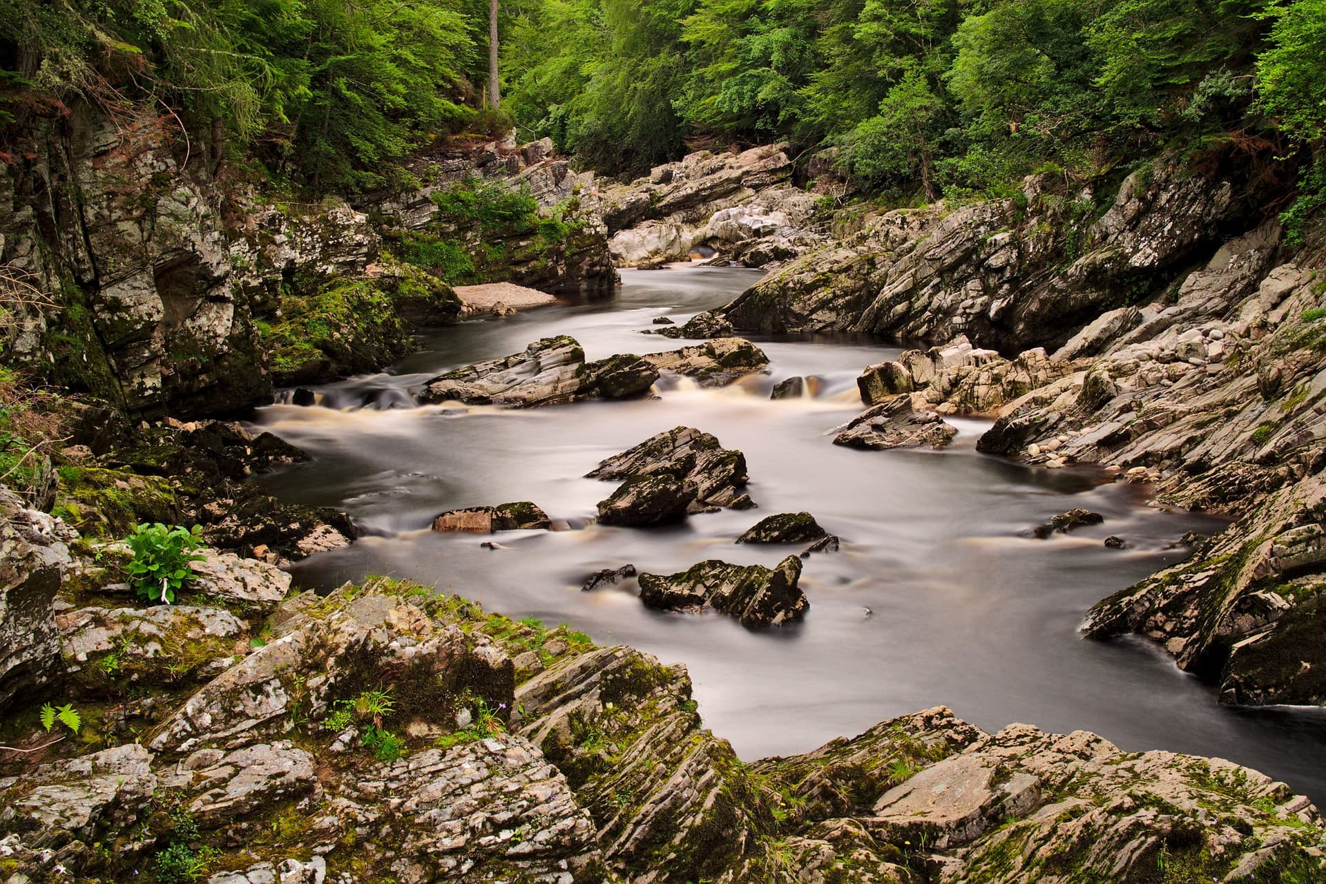 The River Findhorn churning through the narrow rock channel at Randolph's Leap in late summer.