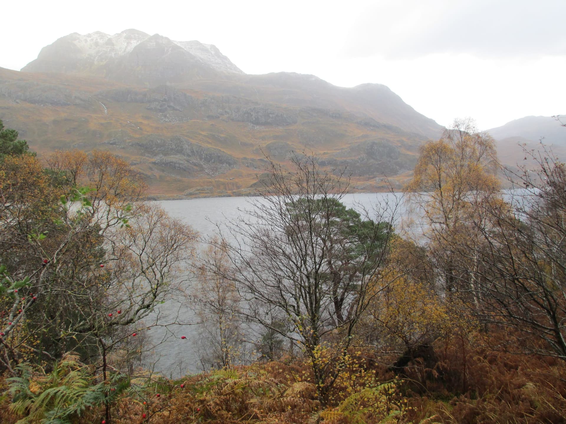 Loch Maree with the quartzite peak of Slioch rising steeply from the far shore in Highland Scotland.