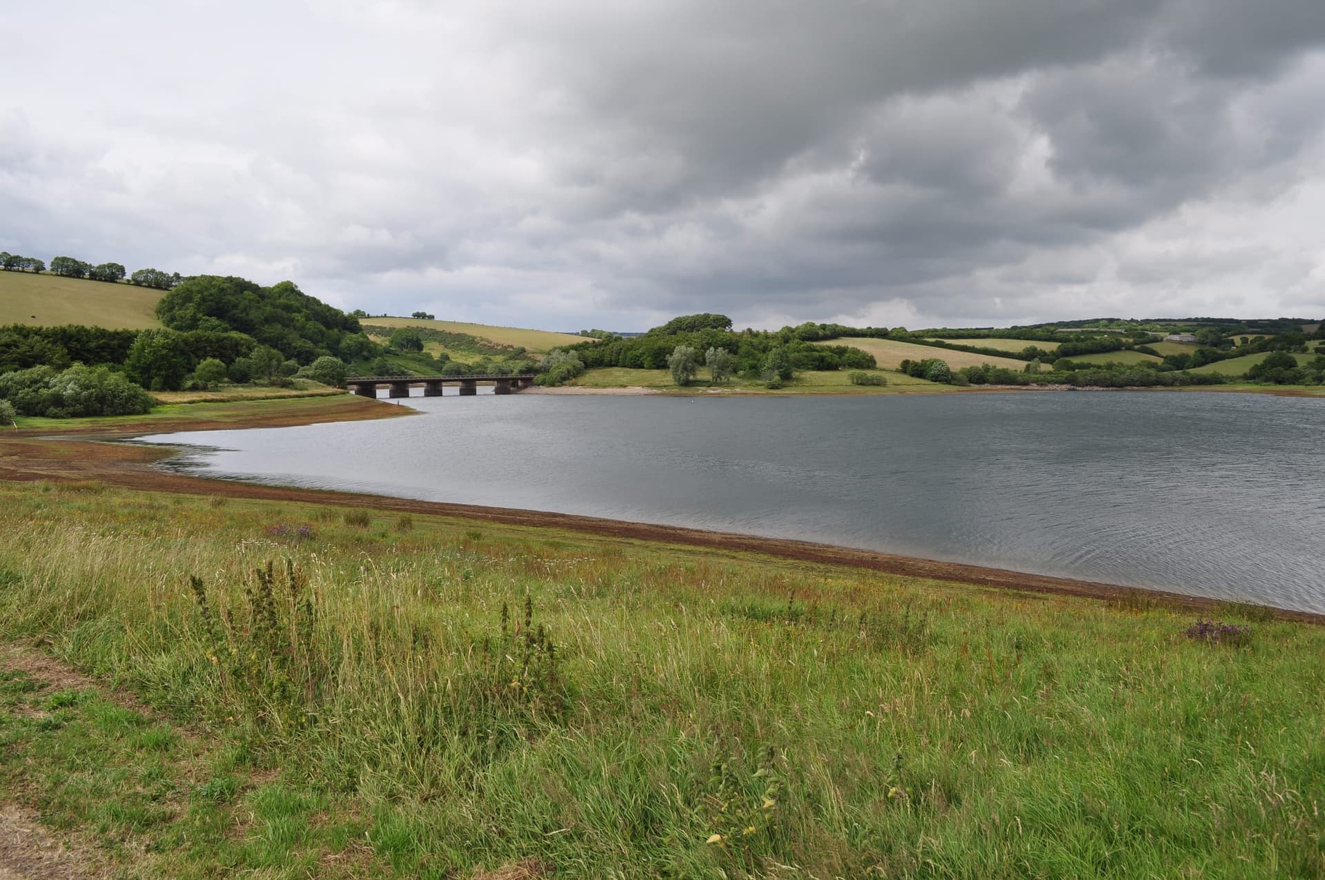 Open water of Wimbleball Lake seen from the circular path, looking toward Berrow Bridge.